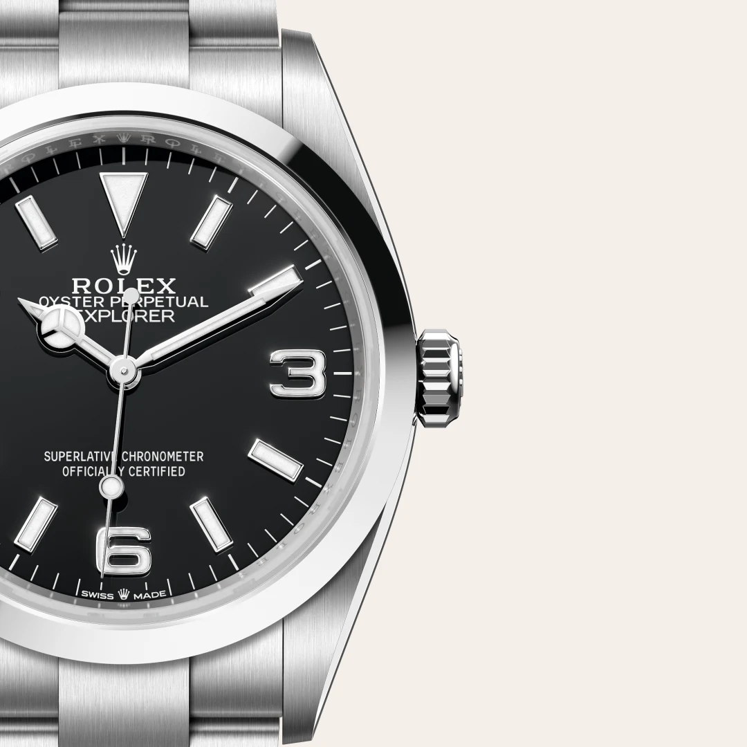 m124270-0001-slide3 | Brela Close-up of a Rolex Oyster Perpetual Explorer wristwatch with black dial and silver indices. | Brela