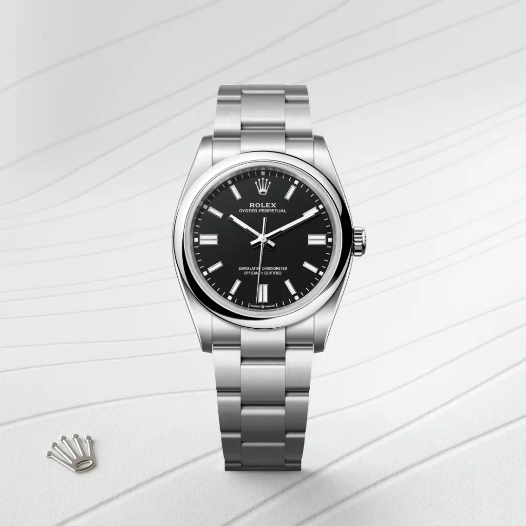 m126000-0014-slide1 | Brela Rolex Oyster Perpetual stainless steel watch with a black dial and brushed bracelet on a light striped surface, Rolex crown logo nearby. | Brela
