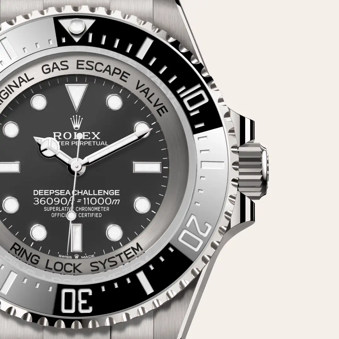 m126067-0002-slide3 | Brela Close-up of a Rolex Deepsea diver's watch showing a black dial, silver bezel, and crown; visible text includes Deepsea Challenge and Ring Lock System. | Brela