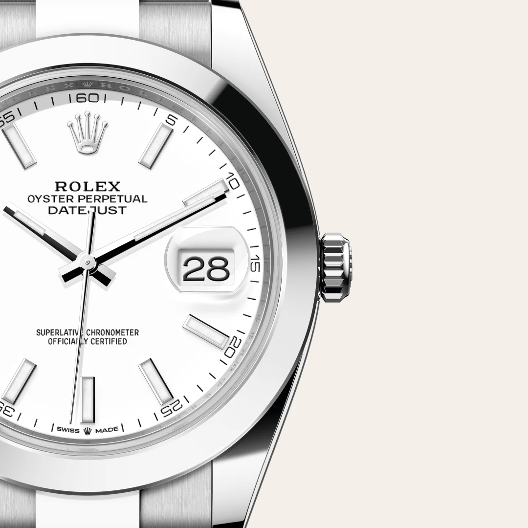 Close-up of a silver Rolex Oyster Perpetual Datejust watch with a white dial, date window showing 28, and stainless steel bracelet. | Brela