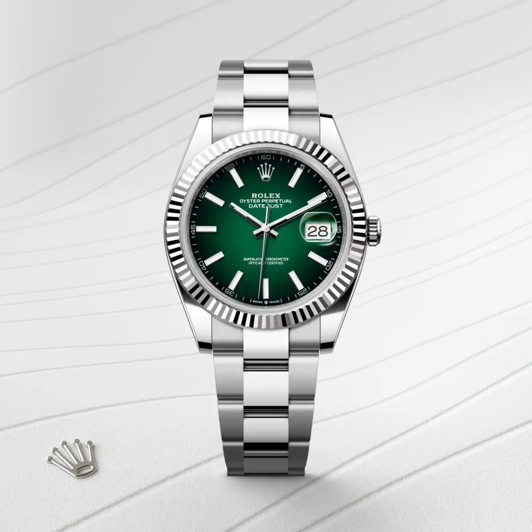 Rolex Oyster Perpetual Datejust wristwatch with a green dial and stainless steel bracelet, date window at 3 o'clock. | Brela