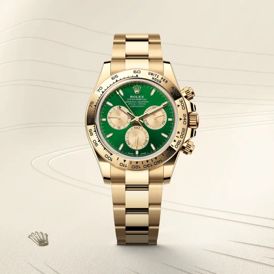 m126508-0008-slide1 | Brela Gold Rolex Cosmograph Daytona with a green dial and three subdials, gold bracelet, front view. | Brela