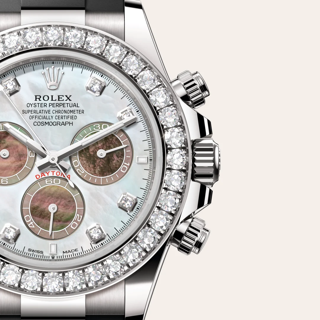 m126589rbr-0001-slide3 | Brela Close-up of a diamond-studded Rolex Daytona wristwatch with a mother-of-pearl dial and silver bracelet | Brela