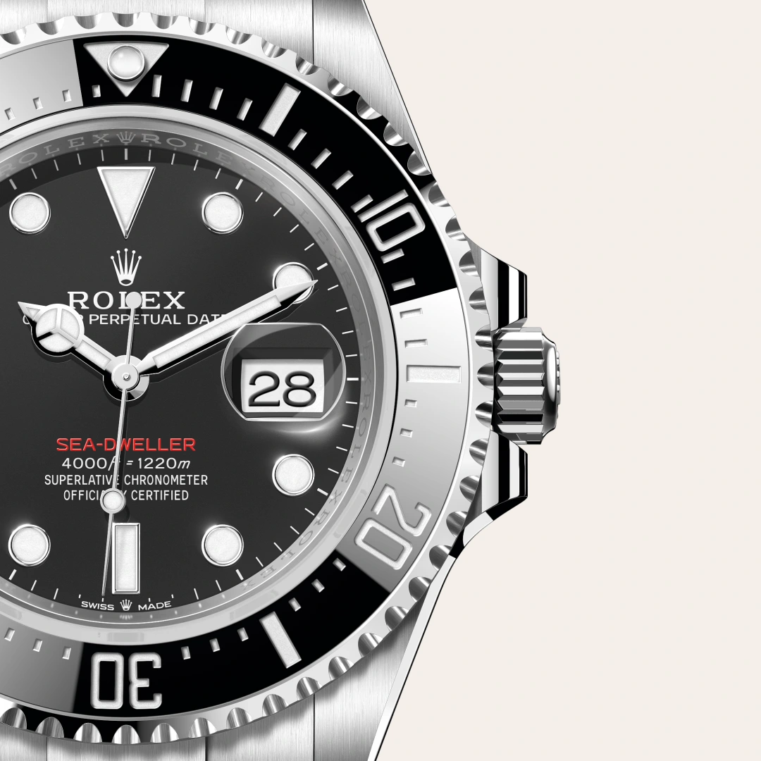 m126600-0002-slide3 | Brela Close-up of a Rolex Sea-Dweller watch showing black dial, date window at 3, and a silver bezel loyal to the design. | Brela