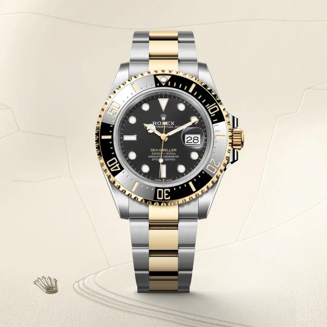 m126603-0001-slide1 | Brela Two-tone Rolex Sea-Dweller with black dial, gold and stainless steel bracelet, date window at 3 o'clock. | Brela