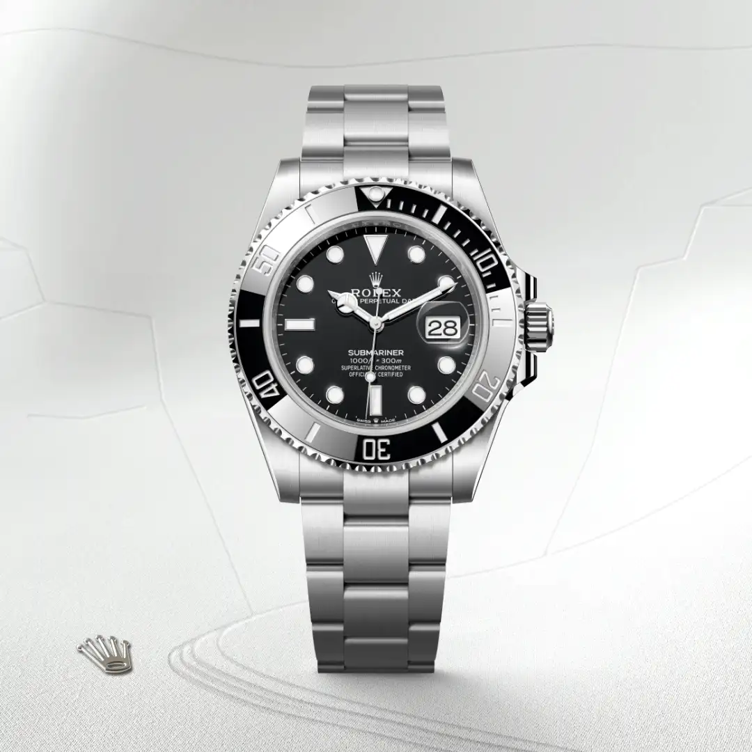 m126610ln-0001-slide1 | Brela Rolex Submariner stainless steel watch with black dial and date window at 3 o'clock on a light background. | Brela