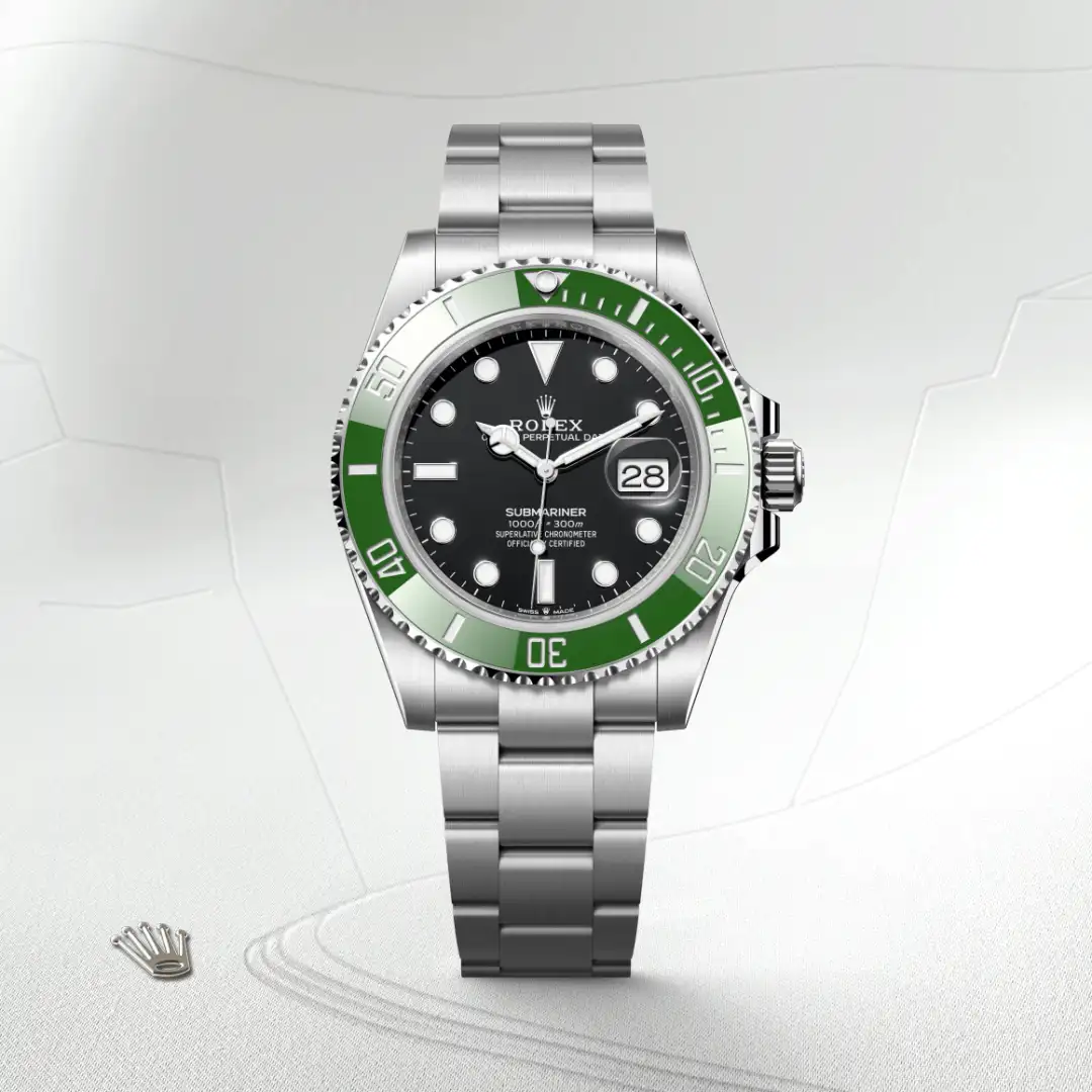 m126610lv-0002-slide1 | Brela Rolex Submariner watch with black dial and green bezel, stainless steel bracelet on a light background. | Brela