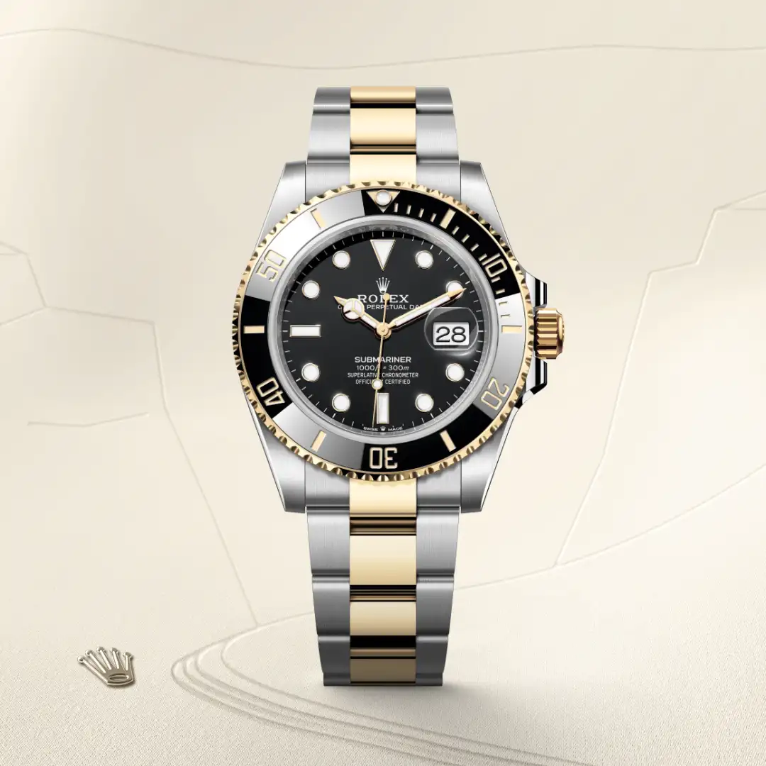 m126613ln-0002-slide1 | Brela Two-tone Rolex Submariner watch with black dial, date window, and gold‑and‑steel bracelet, shown from the front | Brela