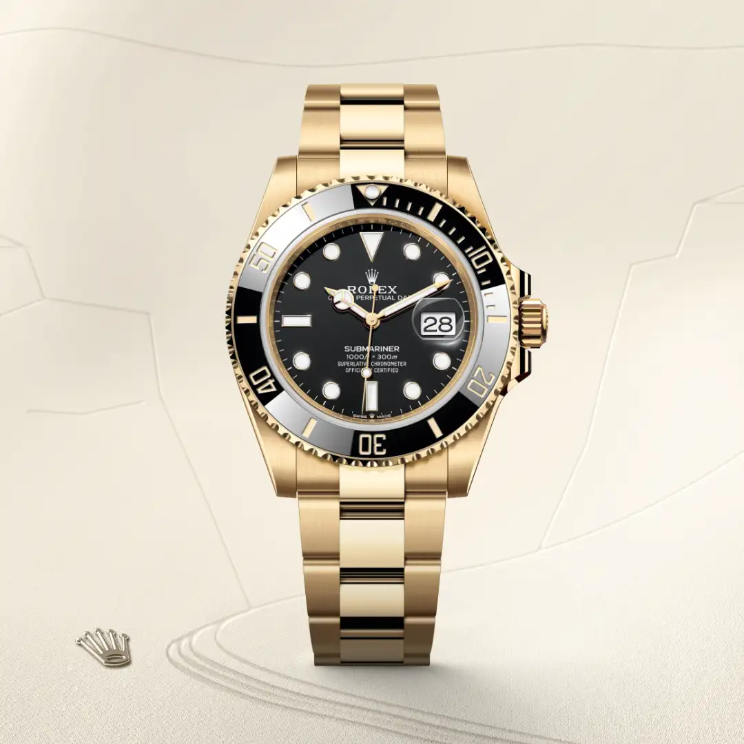 m126618ln-0002-slide1 | Brela Gold Rolex Submariner wristwatch with black dial and date window, central positioning on a light background. | Brela