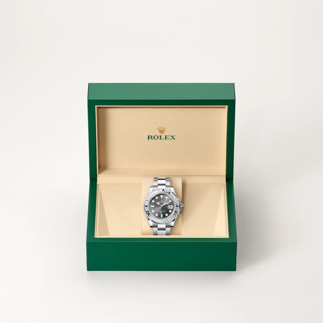 m126622-0001-slide2 | Brela Open green Rolex presentation box with beige interior, displaying a stainless steel Rolex watch on a beige cushion. | Brela