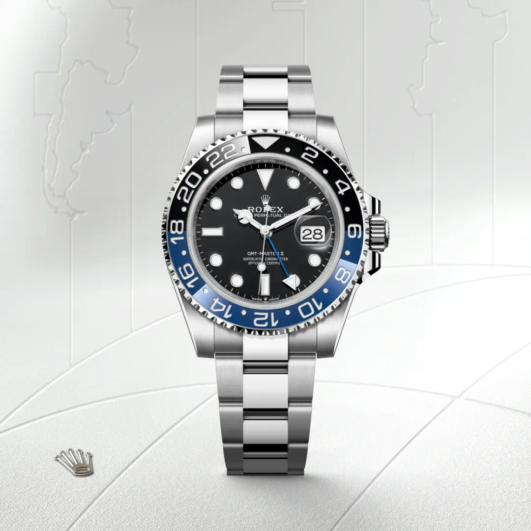 m126710blnr-0003-slide1 | Brela Rolex GMT‑Master II stainless steel watch with black dial and blue‑black 24‑hour bezel, Oyster bracelet, date window at 3. | Brela