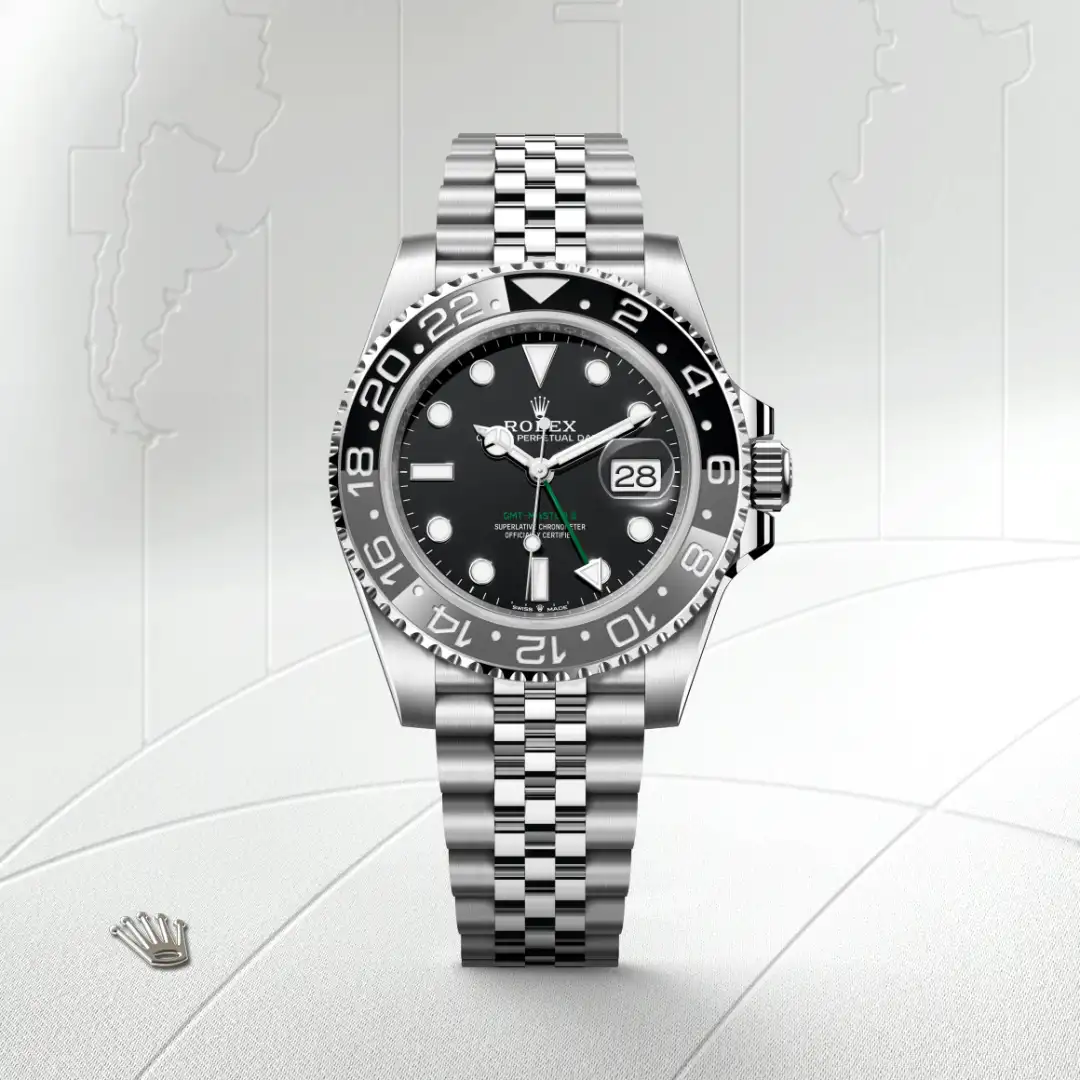 m126710grnr-0003-slide1 | Brela Stainless steel Rolex GMT-Master II watch with black dial and date window, Jubilee bracelet, and rotating bezel. | Brela