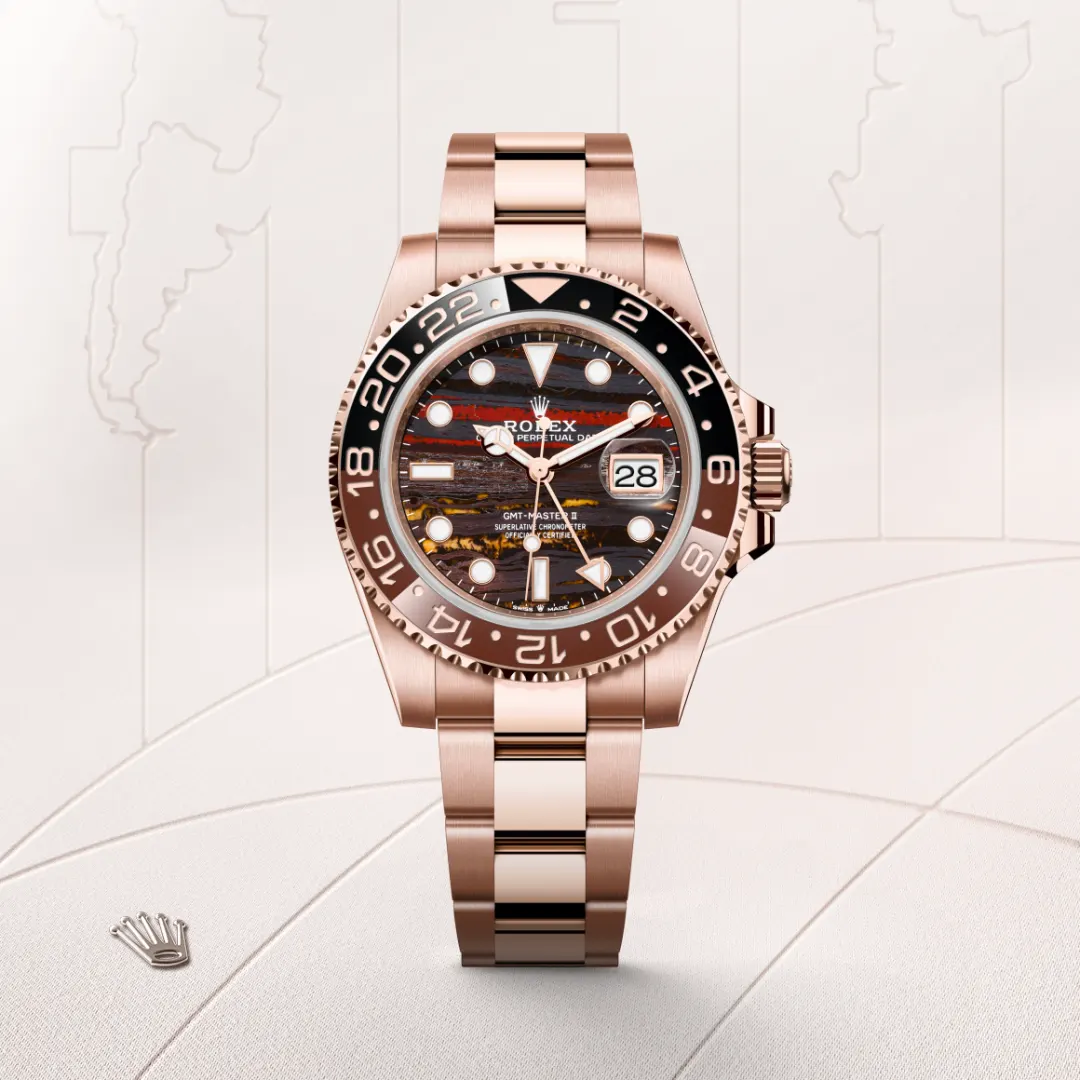 Rose gold Rolex GMT-Master II wristwatch with a black bezel and date window on a light background backdrop | Brela