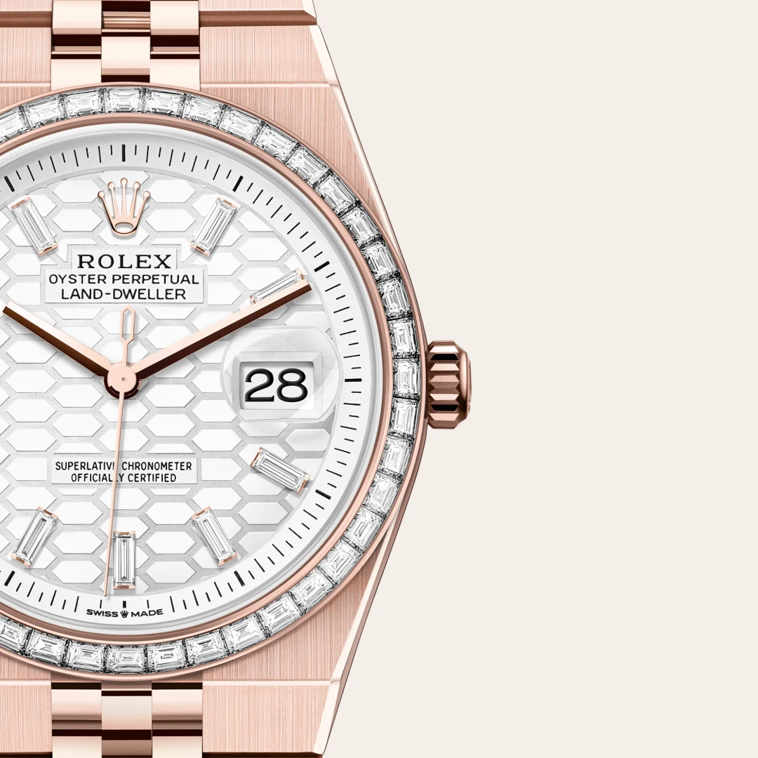 m127285tbr-0002-slide3 | Brela Rose gold Rolex Oyster Perpetual Land-Dweller with a diamond bezel and hexagonal dial, date window showing 28 at 3 o'clock | Brela