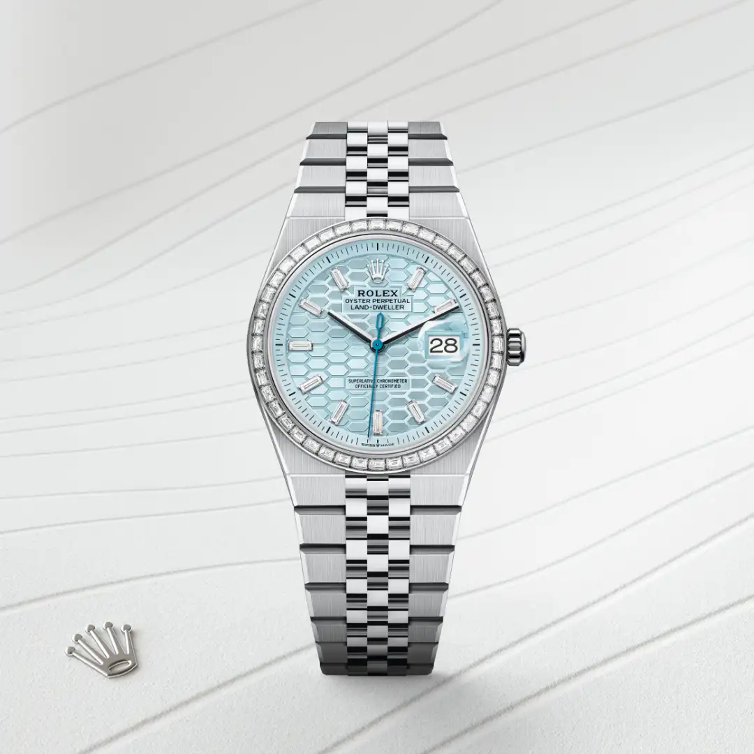 m127286tbr-0001-slide1 | Brela Rolex stainless steel watch with a light blue honeycomb dial, diamond bezel, date window at 3 o'clock, Jubilee bracelet. | Brela