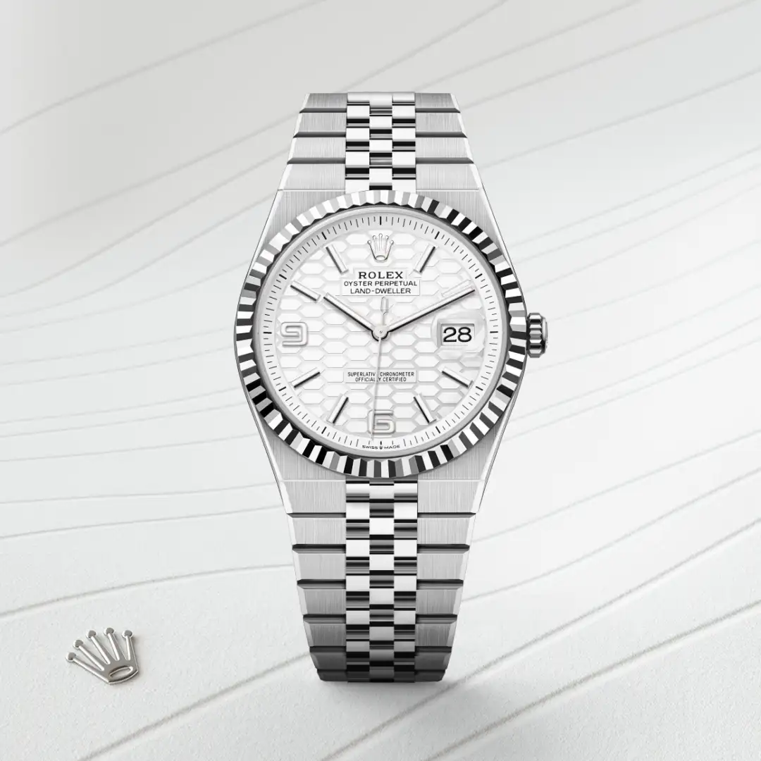 Silver Rolex wristwatch with a white honeycomb dial, fluted bezel, and Jubilee bracelet; date window at 3 o'clock and Rolex crown at 12 o'clock. | Brela