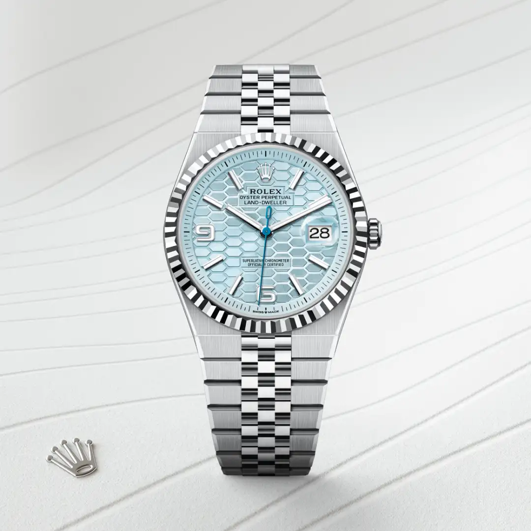 m127336-0001-slide1 | Brela Rolex Oyster Perpetual Datejust with a light blue honeycomb dial, silver fluted bezel, and Jubilee bracelet | Brela