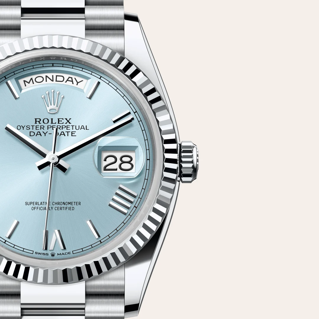 m128236-0018-slide3 | Brela Close-up of a Rolex Oyster Perpetual Day-Date watch with a light blue dial showing Monday and the date 28. | Brela