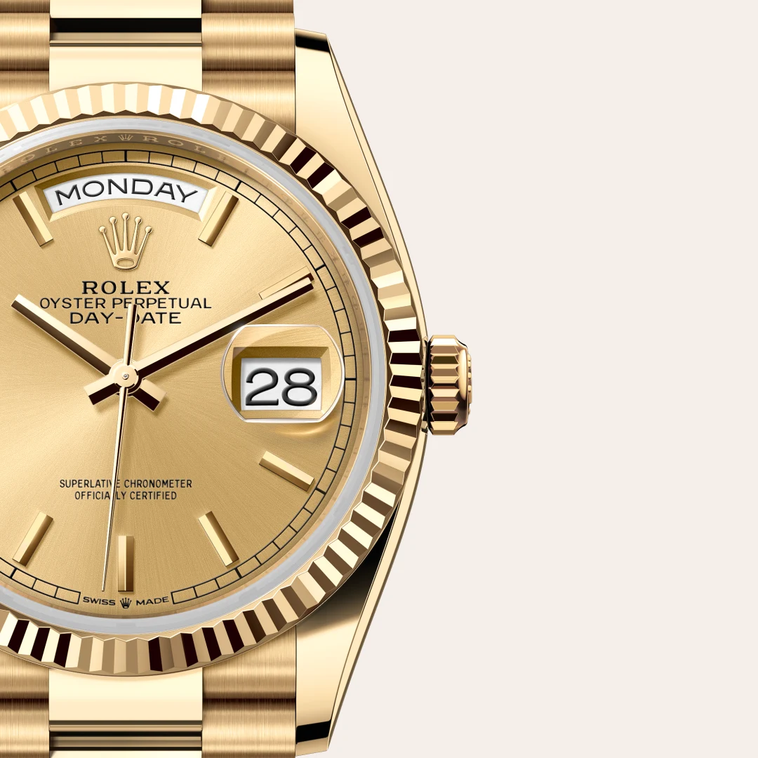 m128238-0045-slide3 | Brela Close-up of a gold Rolex Day-Date watch showing Monday and the date 28 on the window at 3 o'clock. | Brela