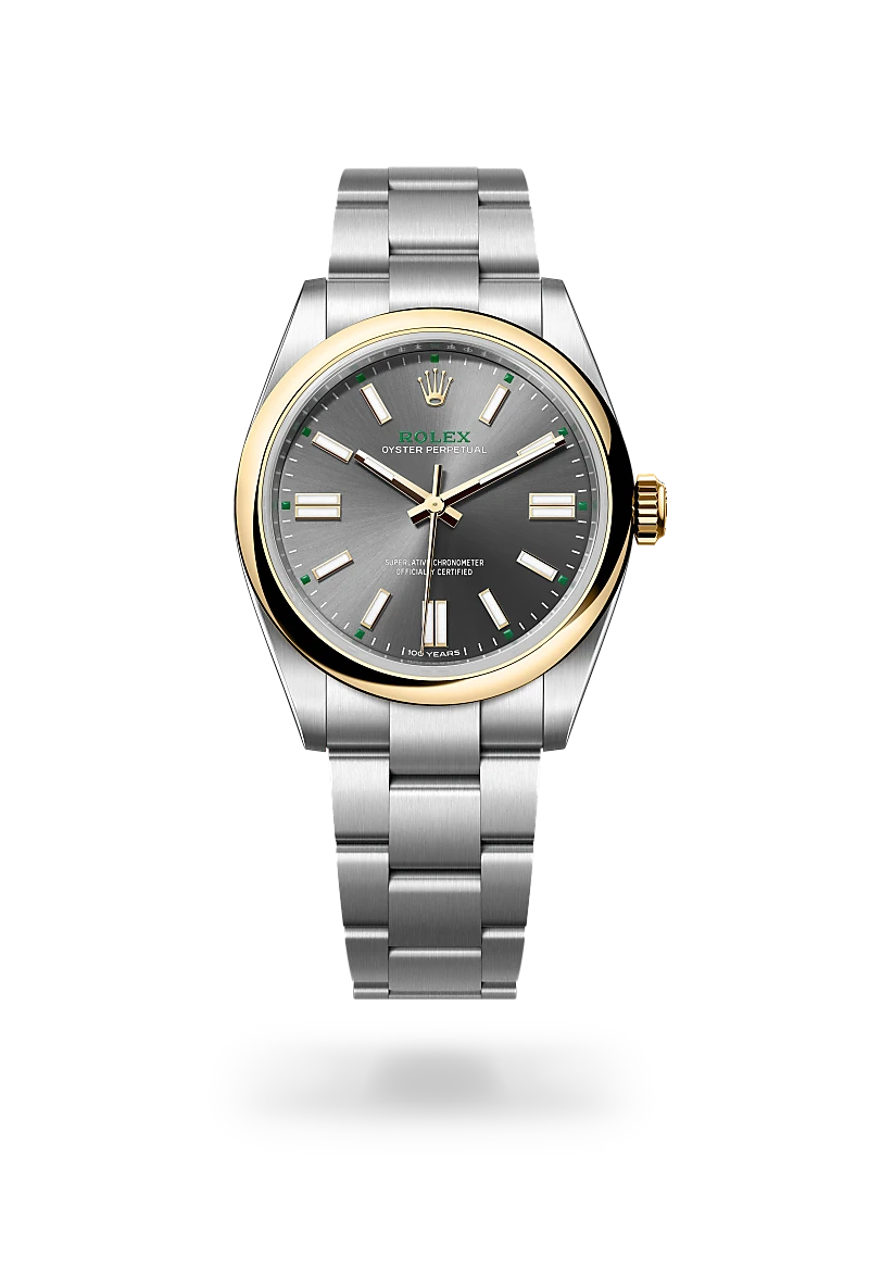 m134303-0001-upright-landscape | Brela Rolex Oyster Perpetual wristwatch with two-tone gold bezel and stainless steel bracelet on a dark background | Brela