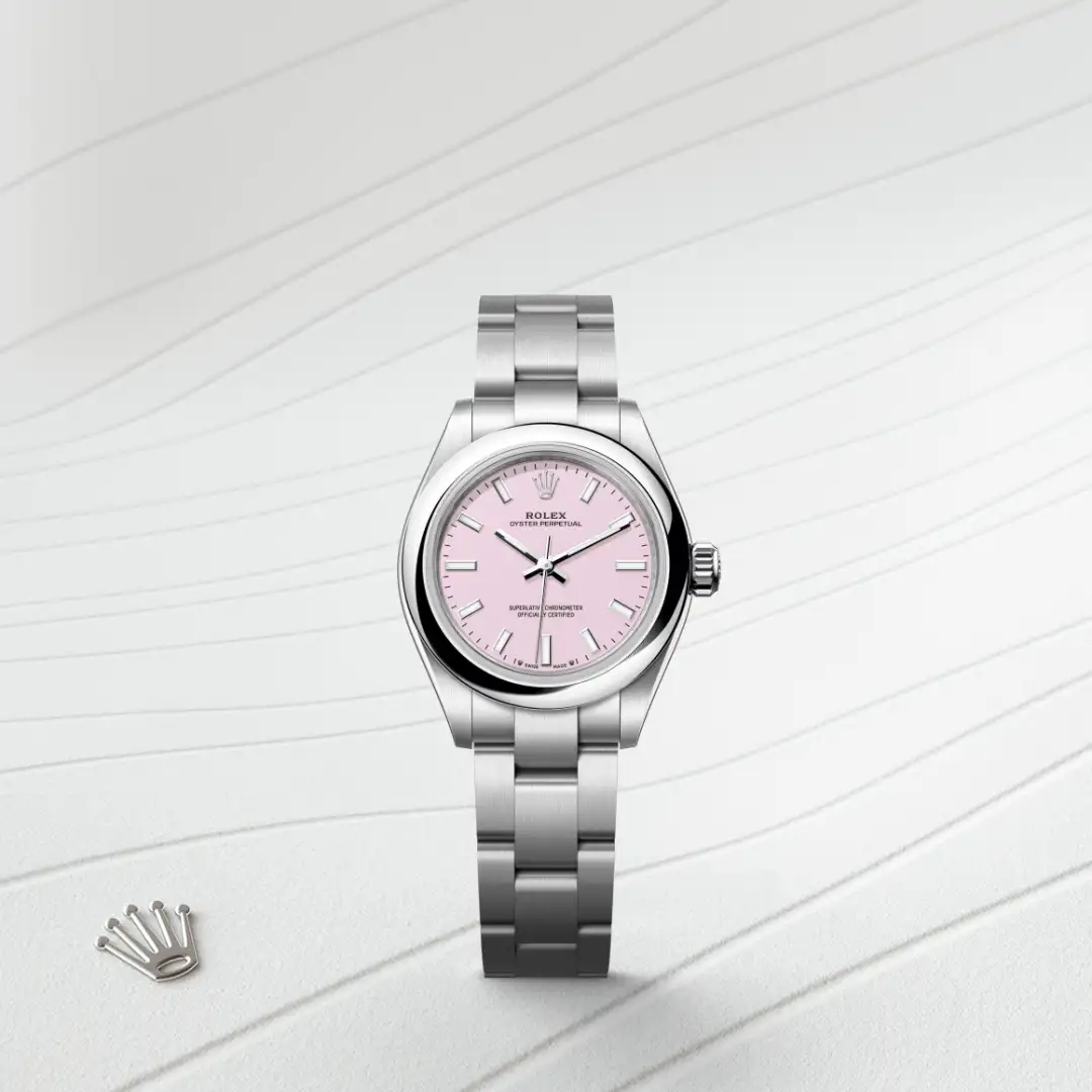m276200-0009-slide1 | Brela Rolex Oyster Perpetual watch with a pink dial and stainless steel bracelet on a light striped surface, Rolex crown emblem nearby. | Brela