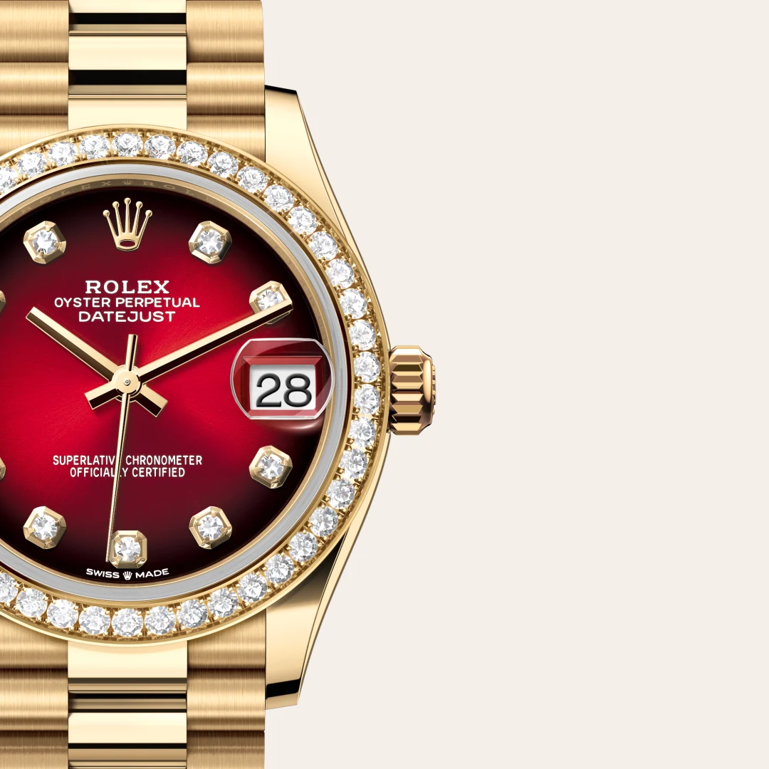 Gold Rolex watch with diamond bezel and red dial showing date 28, Swiss made, luxurious timepiece. | Brela