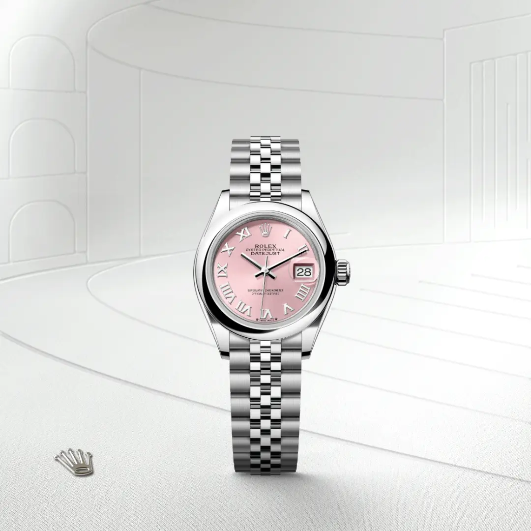 m279160-0013-slide1 | Brela Rolex Datejust wristwatch with pink dial and silver Jubilee bracelet on a white backdrop. | Brela