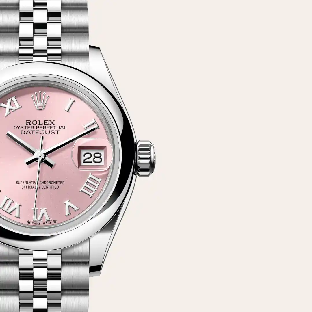 m279160-0013-slide3 | Brela Close-up of a stainless steel Rolex Datejust watch with a pink dial and date window showing the number 28. | Brela