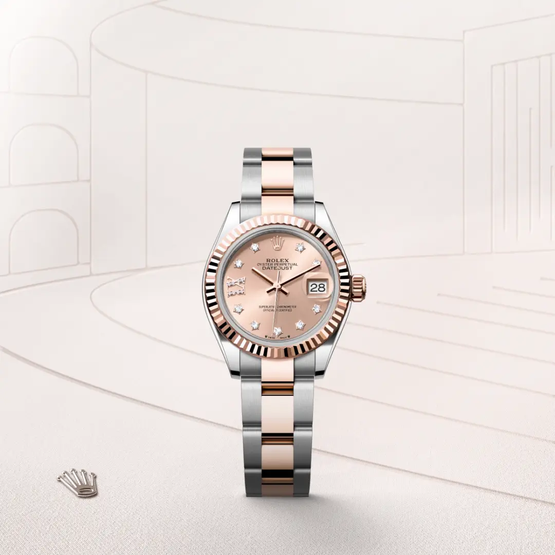 Two-tone Rolex Datejust watch with a rose-gold dial, diamond hour markers, and a fluted bezel showing the date at 3 o'clock in pink-gold tones. | Brela