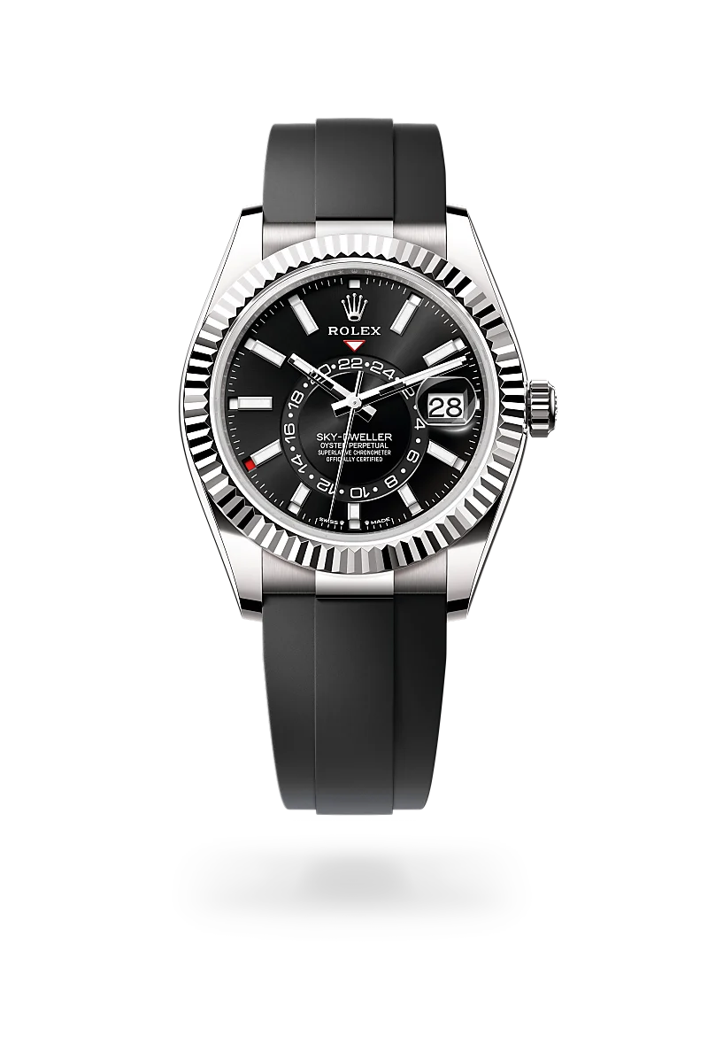 Rolex Sky-Dweller wristwatch with black dial, fluted bezel, stainless steel case, and black strap; date window at 3 o'clock. | Brela