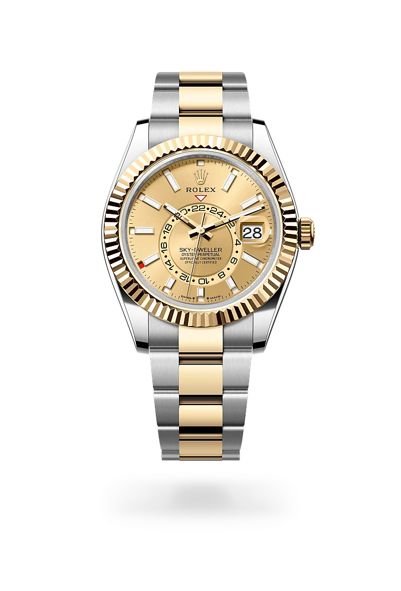 Two-tone Rolex Sky-Dweller watch with gold dial, fluted bezel, and stainless steel and yellow-gold bracelet; date window at 3 o'clock. | Brela