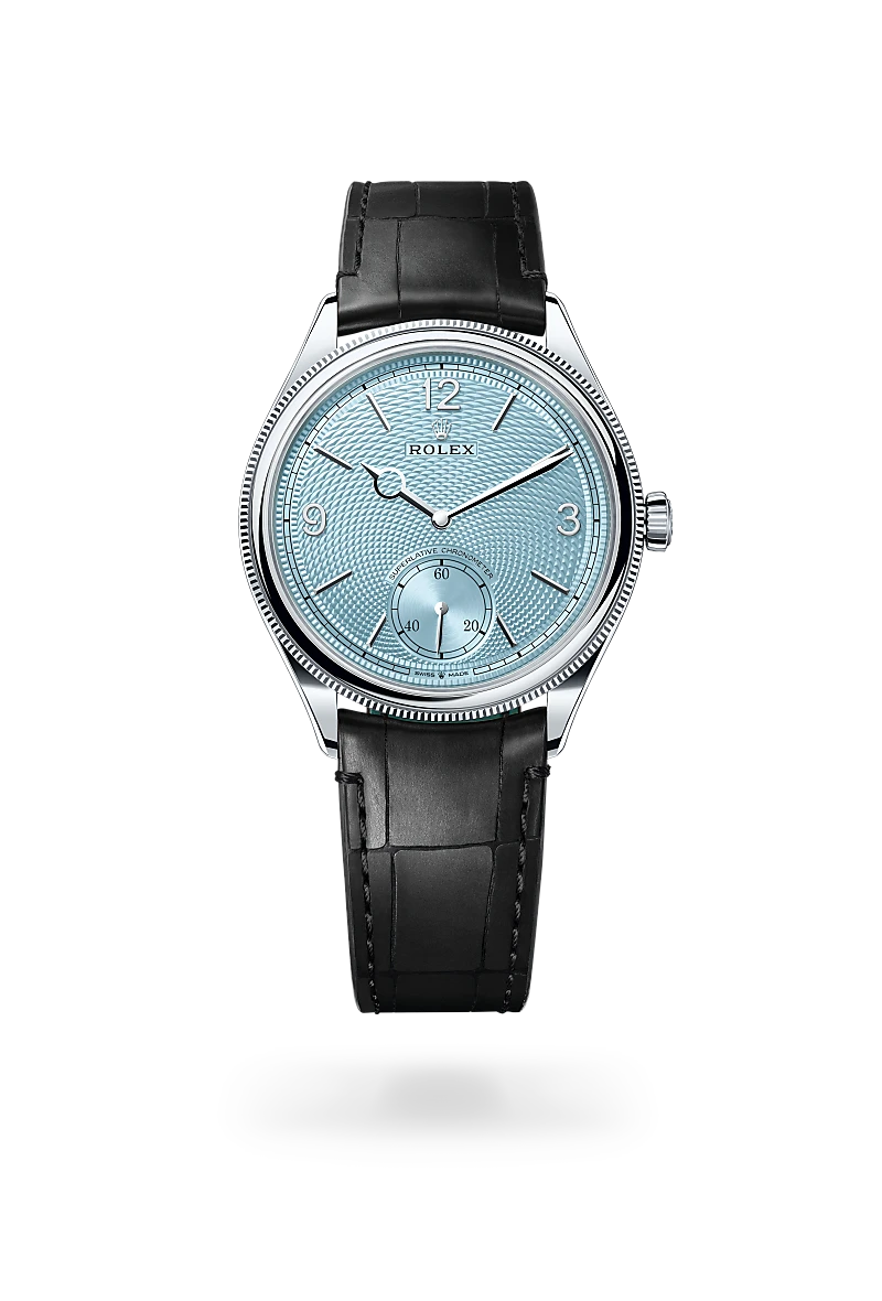 m52506-0003-upright-landscape | Brela Rolex wristwatch with a light blue patterned dial and black leather strap, showing time around 10:10 and a small seconds subdial at 6 o'clock | Brela