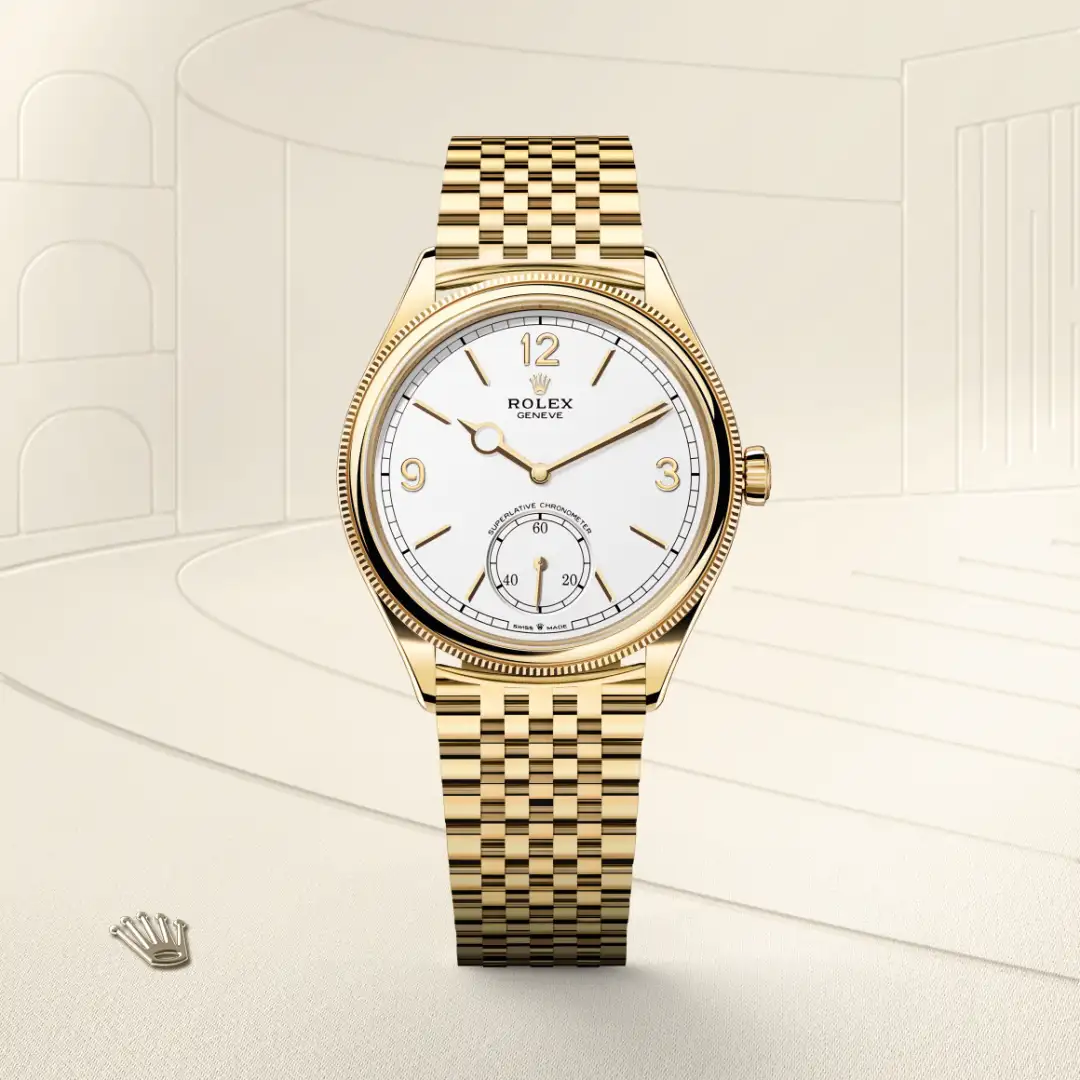 m52508-0008-slide1 | Brela Gold Rolex wristwatch with white dial, gold indices and hands, and a subdial at 6 o'clock on a polished gold bracelet. | Brela