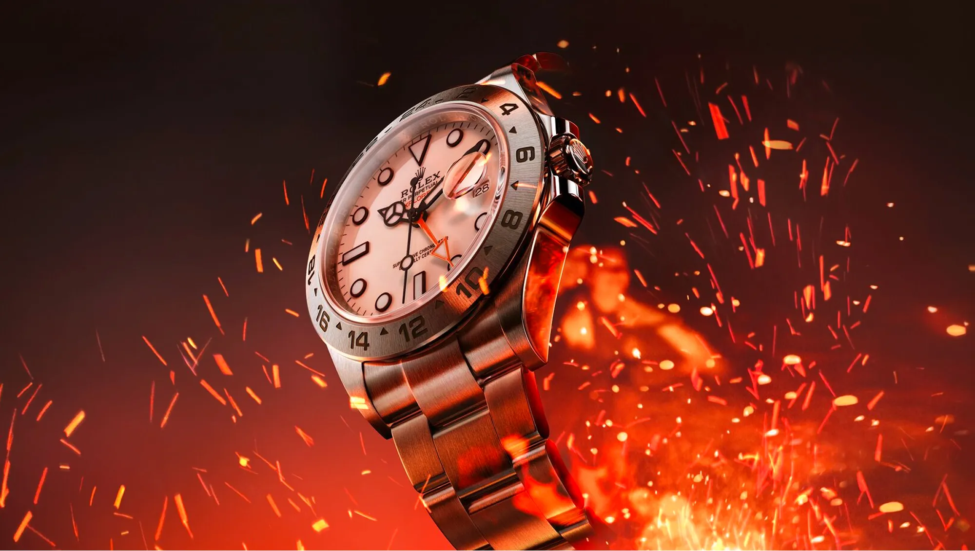 Close-up of a Rolex wristwatch with a metallic band, surrounded by glowing orange sparks and embers.