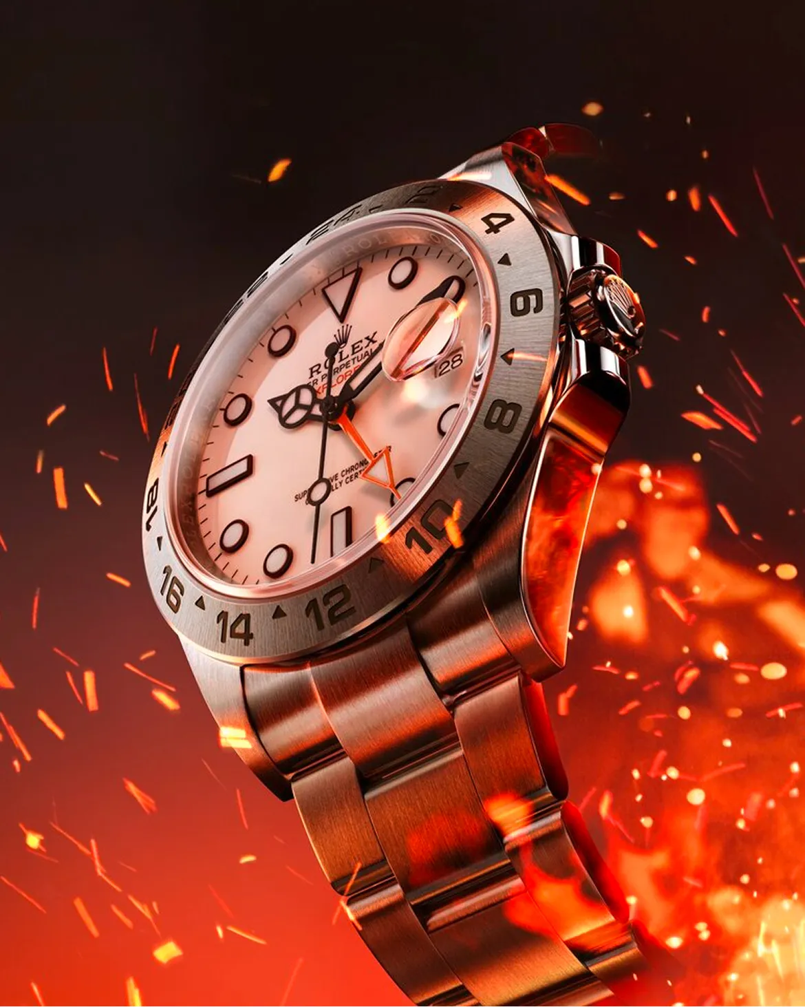 Close-up of a stainless steel Rolex watch with a white dial and red accents, angled against a fiery orange background with sparks.