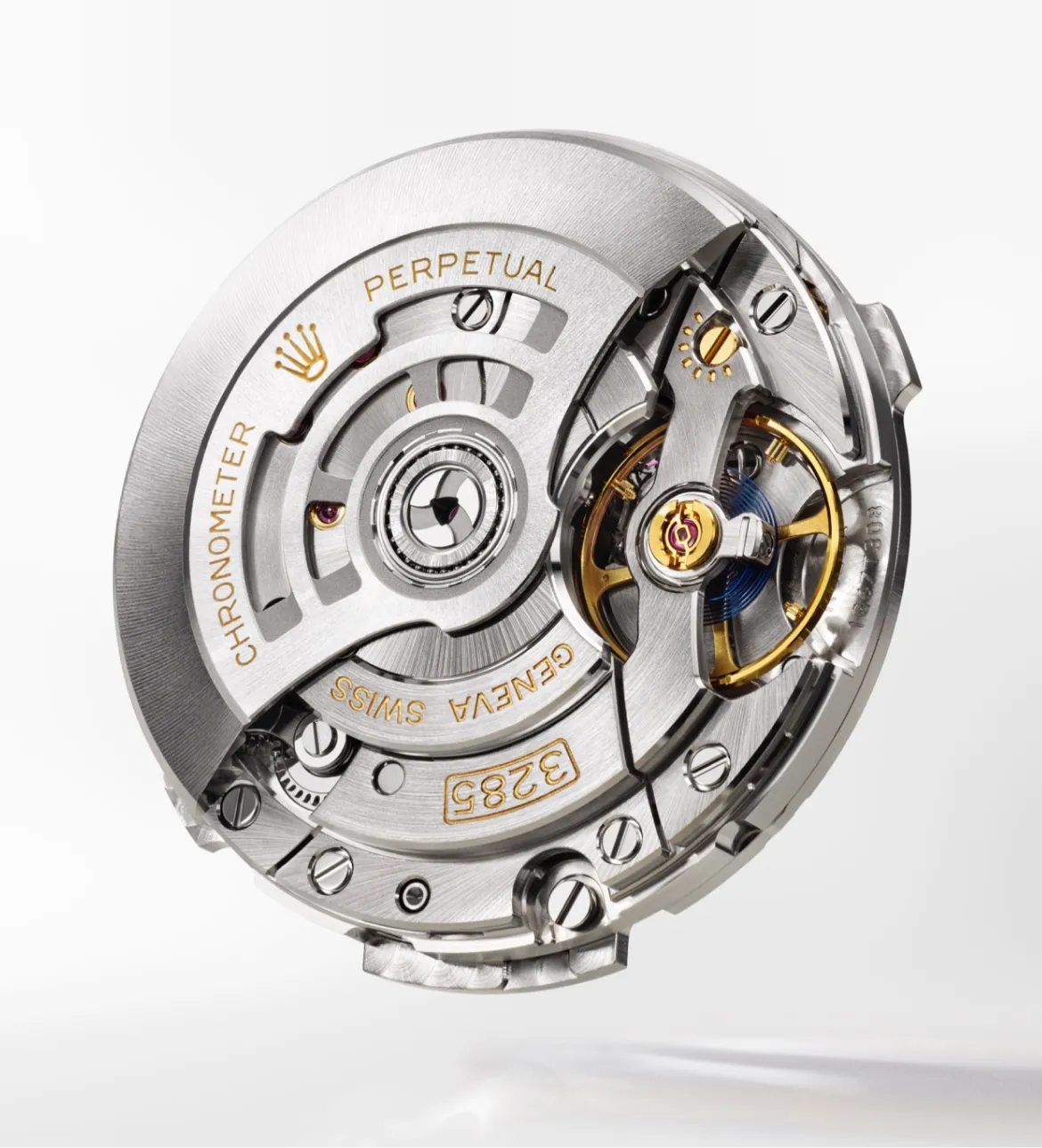 Close-up of a high-end automatic watch movement, showing gears, rotor, and jewel bearings with engraved labels like 'PERPETUAL' and 'GENEVA' on a silver metal backdrop.