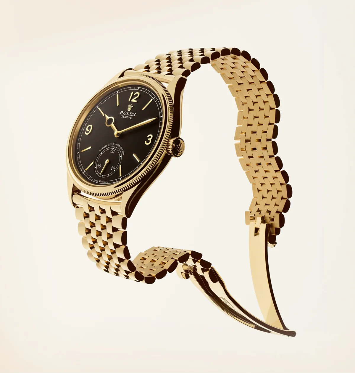 rolex-perpetual-1908-sleek-design-m52508-0008-landscape Gold Rolex wristwatch with black dial and linked bracelet, angled to show case and crown.