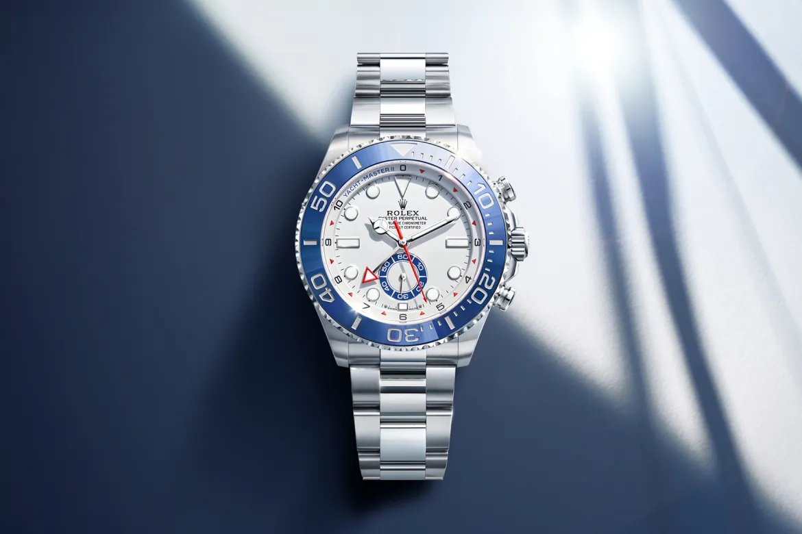 rolex-watches-yacht-master-ii-m126680-0001-landscape | Brela Rolex Yacht-Master II stainless steel watch with a blue bezel on a blue background, close view of the timepiece | Brela