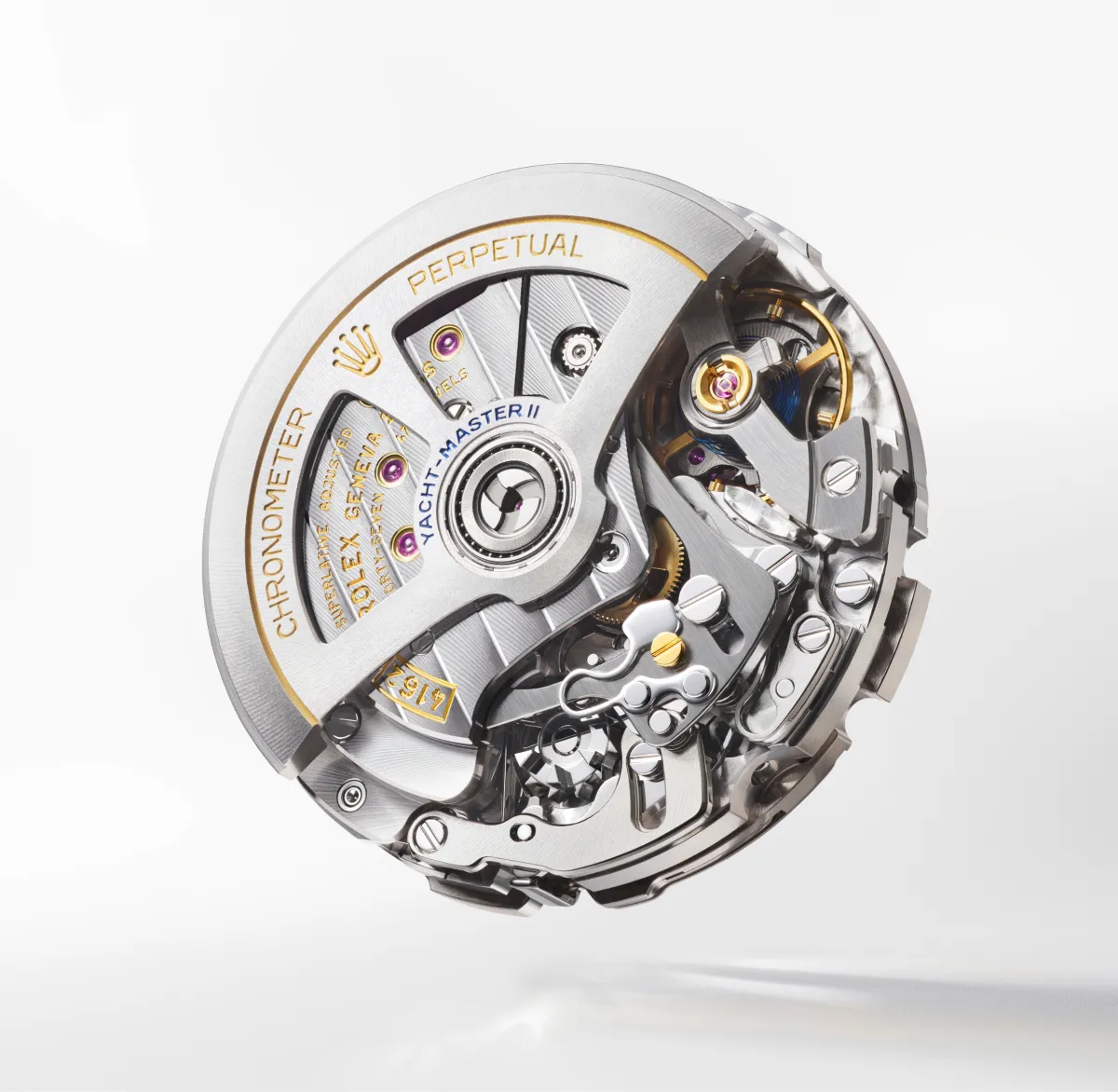 Close-up of a luxury watch movement with gears, screws, and a gold-accented rotor.