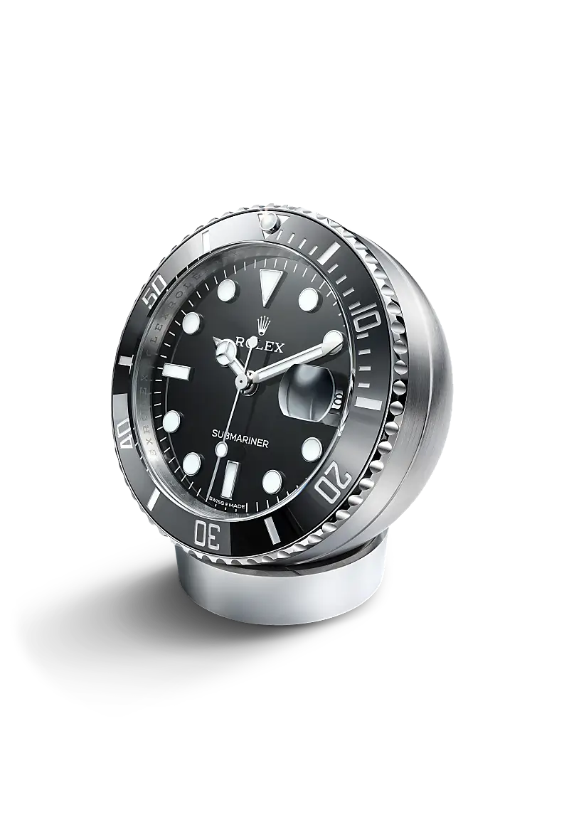 rolex-accessories-c909010ln-0001-packshot | Brela Close-up of a Rolex Submariner diver's watch with a black dial and silver rotating bezel on a display stand. | Brela