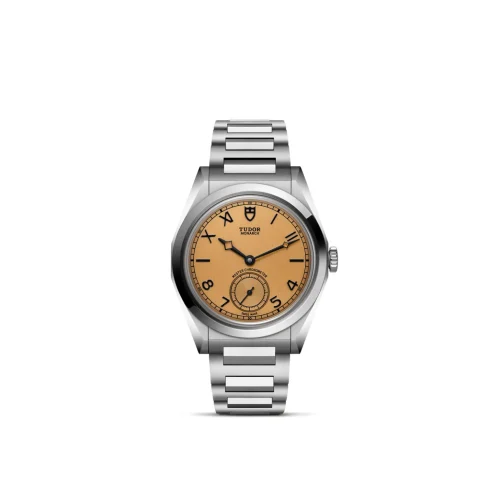 Stainless steel Tudor Monarch wristwatch with an orange dial, black numerals, and a metal bracelet seen from the front edge center.