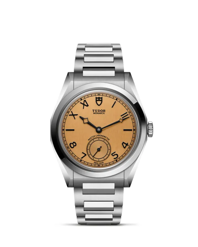 m2639w1a0u-0001_upright-wh-std-grid | Brela | Brela Tudor Monarch stainless steel wristwatch with a tan dial and bold black numerals, featuring a small seconds subdial at 6 o'clock. | Brela | Brela