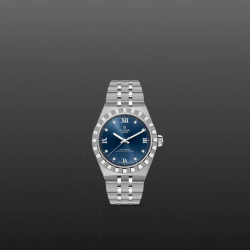 Silver stainless steel watch with a blue dial and diamond hour markers set against a dark gradient background.