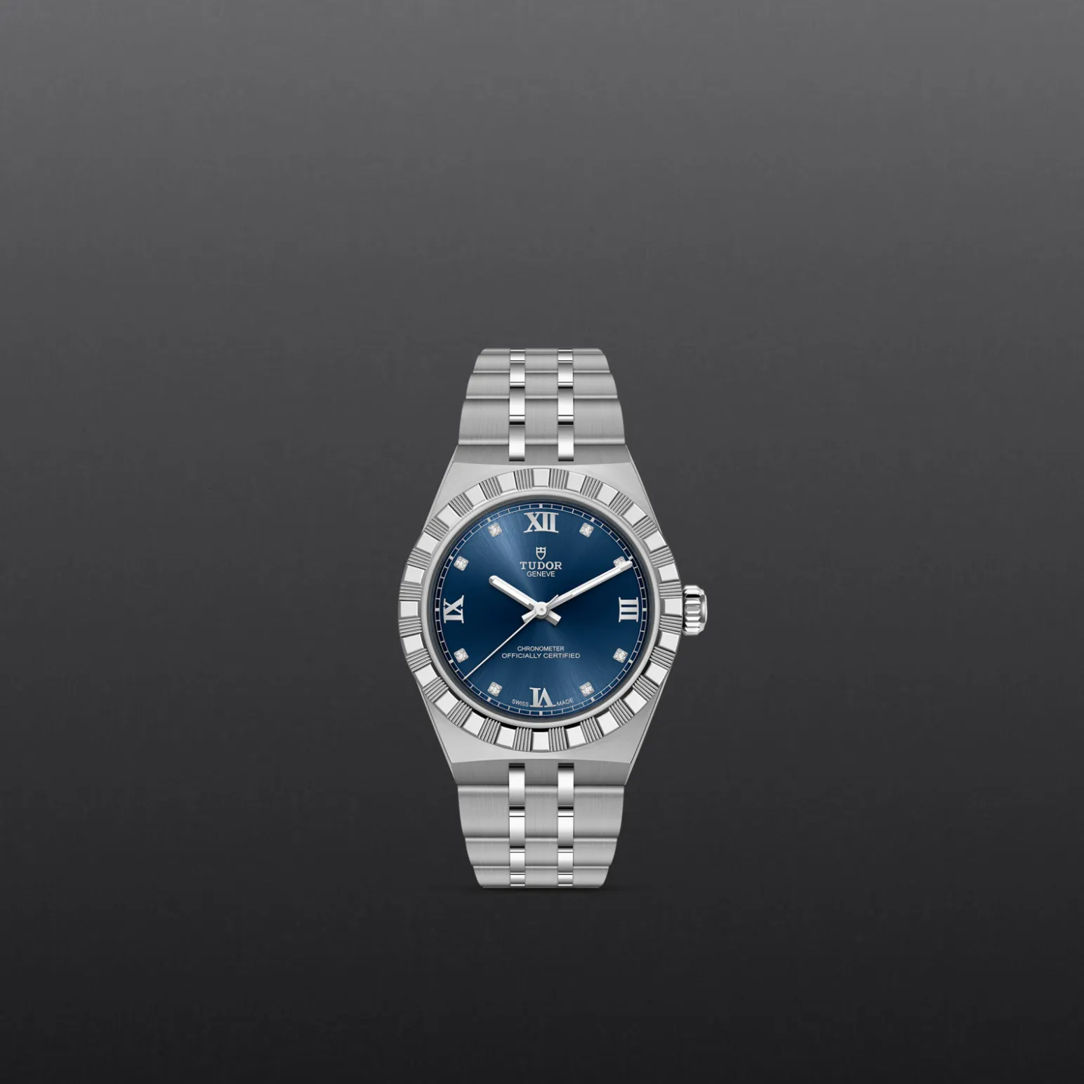 m2830a1a0-0001-upright_watch_grey_background-model_page_only_standard_size | Brela Silver Tudor wristwatch with blue dial and Roman numerals on a dark gradient background. | Brela
