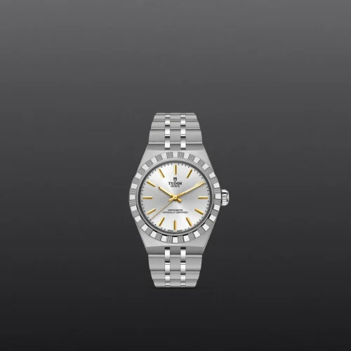 Silver Tudor wristwatch with a white dial, gold hands and markers, and a stainless steel bracelet against a dark gradient background.