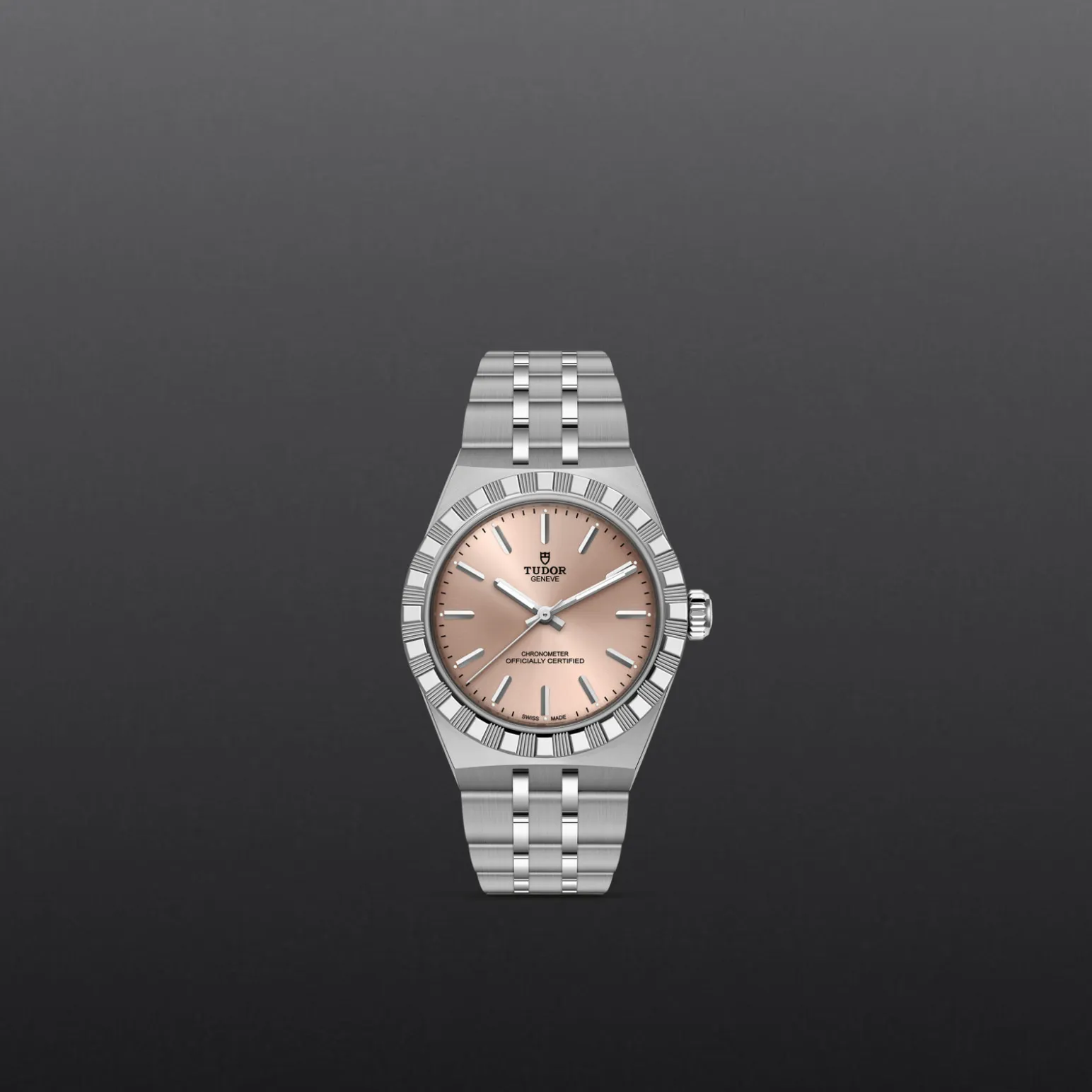 m2830a1a0-0003-upright_watch_grey_background-model_page_only_standard_size | Brela Tudor wristwatch with a pink dial and silver stainless steel bracelet against a dark gray gradient background | Brela