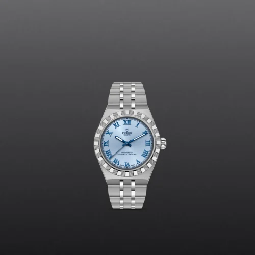 Silver wristwatch with a light blue dial and Roman numeral hour markers displayed against a dark gradient background.