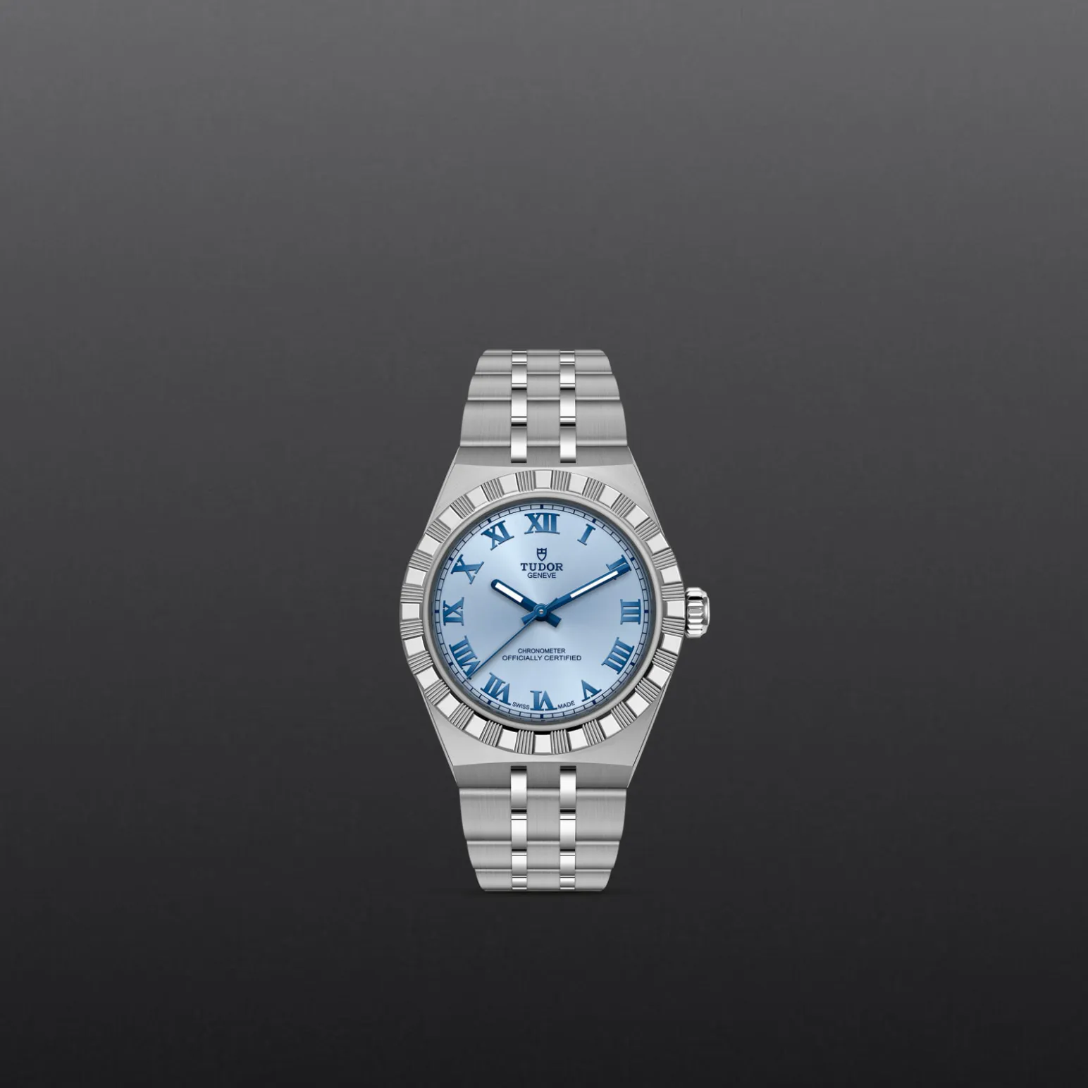 m2830a1a0-0004-upright_watch_grey_background-model_page_only_standard_size | Brela Stainless steel Tudor wristwatch with a light blue dial and Roman numeral hour markers on a dark gray gradient background | Brela