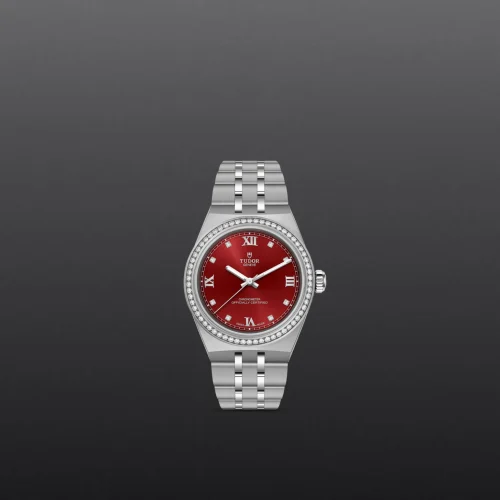 Silver stainless steel Tudor watch with a red dial and diamond-set bezel on a dark gradient background