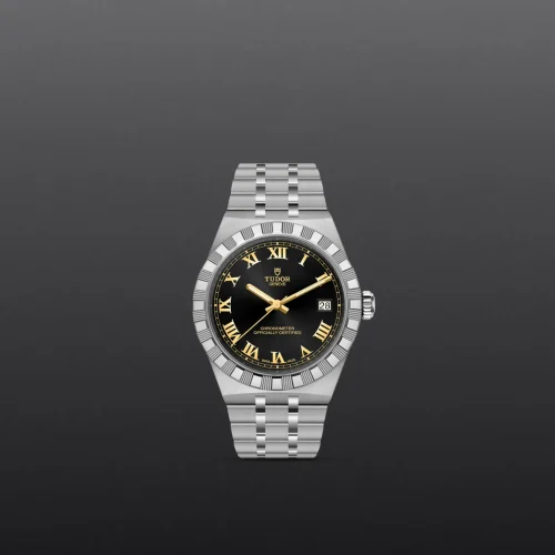 Tudor stainless steel wristwatch with a black dial, gold Roman numerals, and a date window at 3 o'clock on a metallic bracelet.